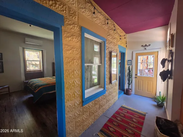 a bedroom with furniture and a window