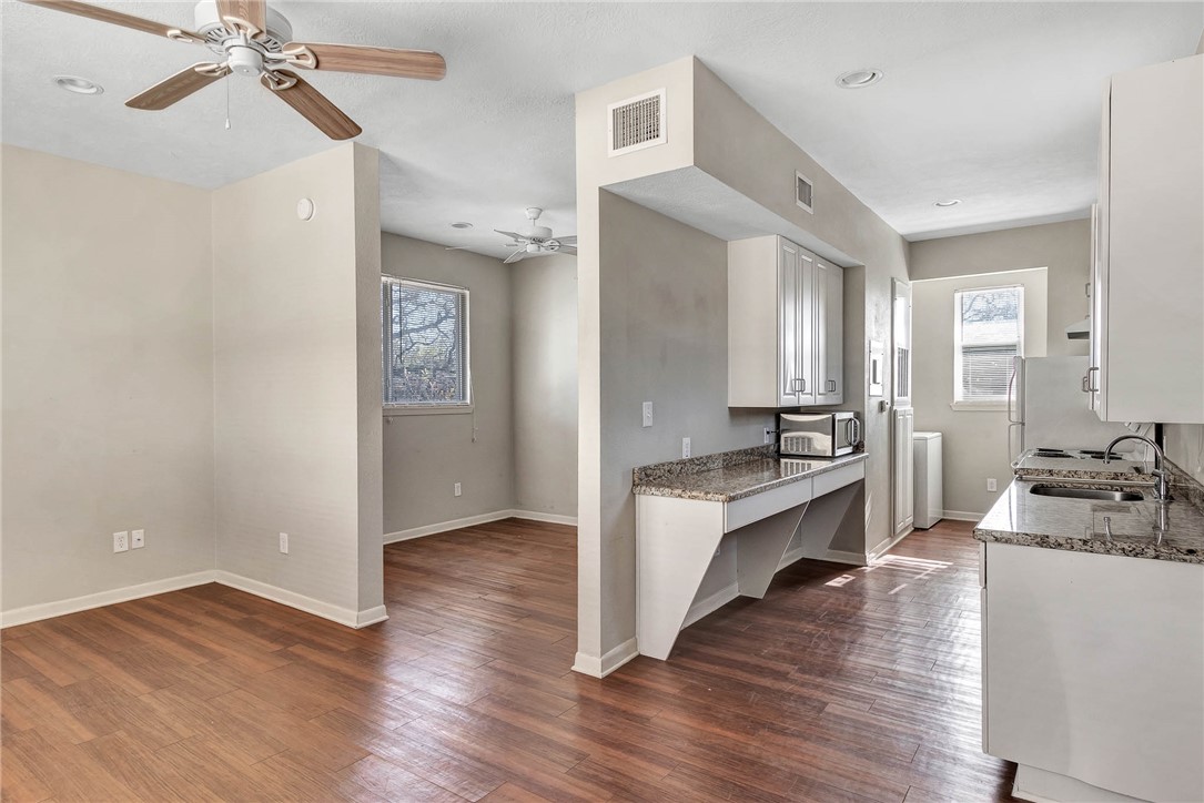209 Davis Street, Unit MULTIPLE S AVAILABLE Bryan, TX 77801 - Photo 5 of 11 a view of a very nice looking kitchen with wooden floor and a sink