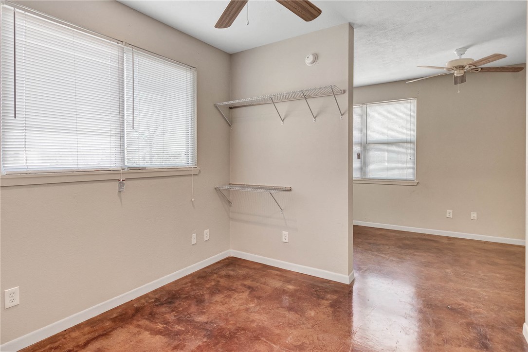 209 Davis Street, Unit MULTIPLE S AVAILABLE Bryan, TX 77801 - Photo 7 of 11 an empty room with windows and closet