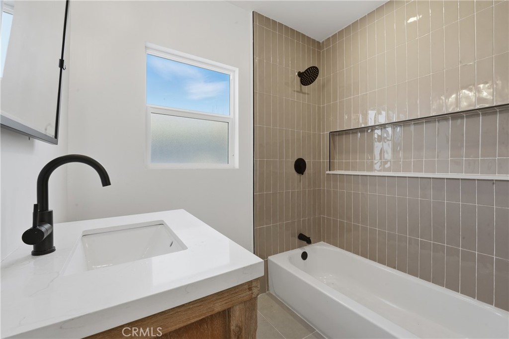 1736 North McDivitt Avenue Compton, CA 90221 - Photo 19 of 30 a bathroom with a sink a toilet and shower