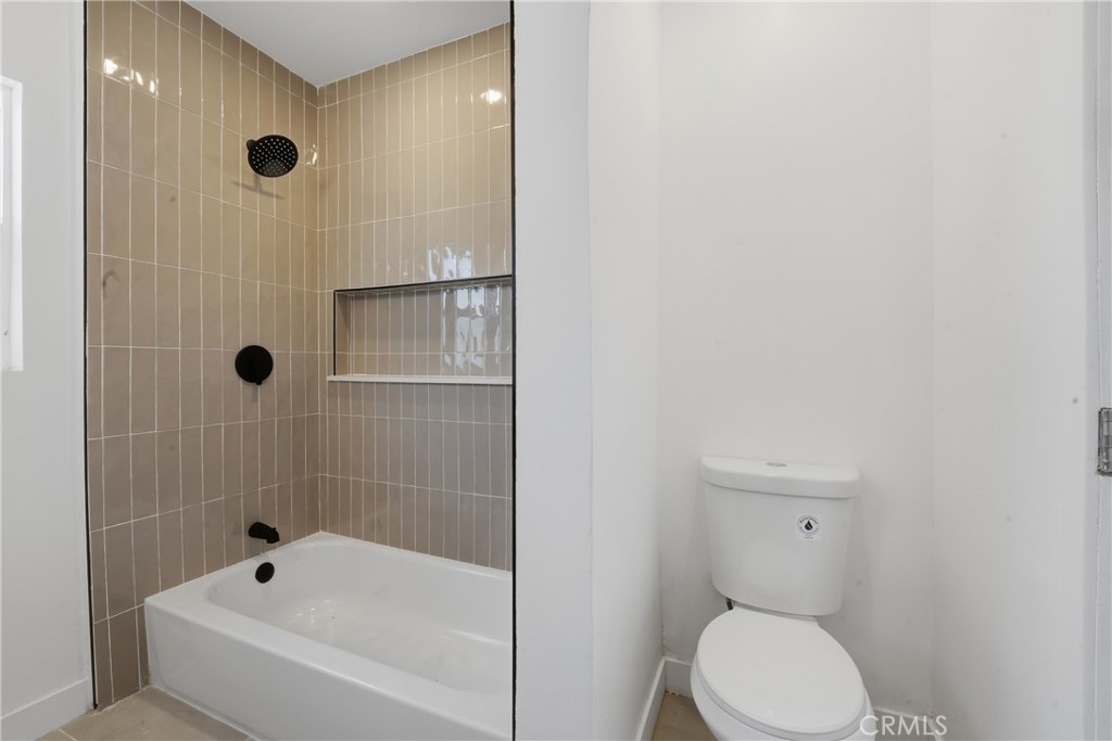 1736 North McDivitt Avenue Compton, CA 90221 - Photo 21 of 30 a bathroom with a toilet and shower