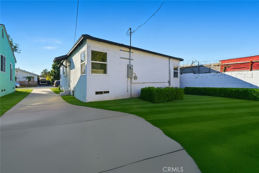 1736 North McDivitt Avenue Compton, CA 90221 - Photo 28 of 30 a front view of house with yard and green space