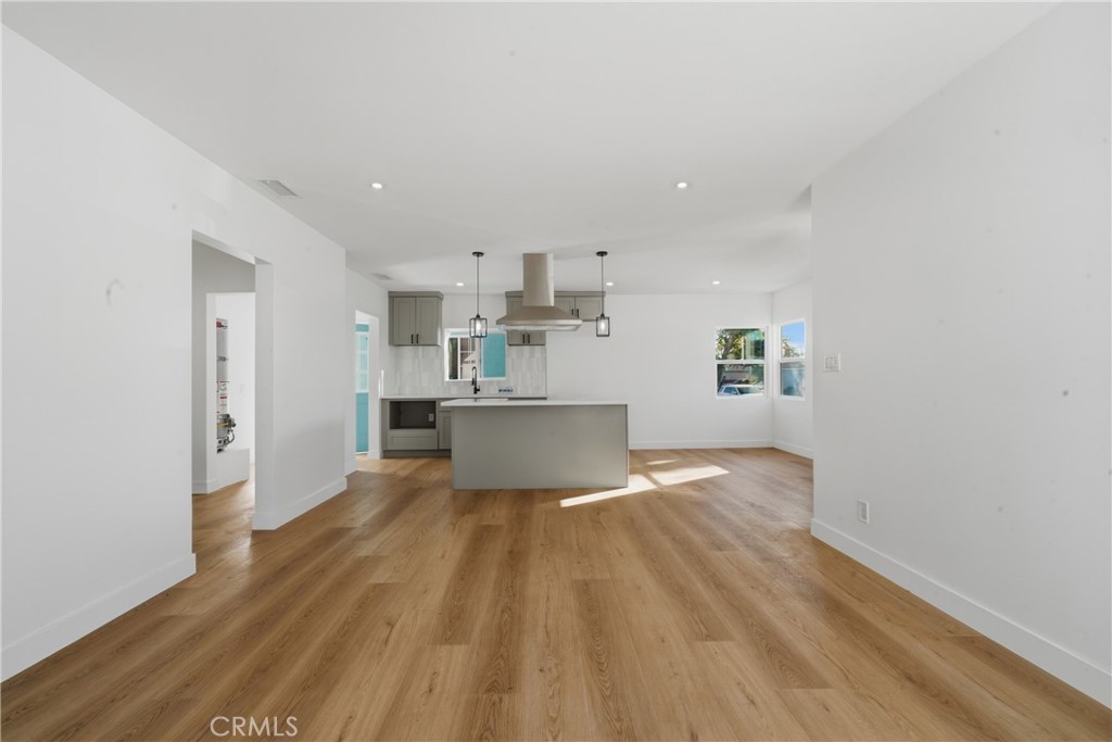 1736 North McDivitt Avenue Compton, CA 90221 - Photo 9 of 30 a view of kitchen and empty room with wooden floor