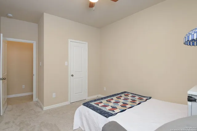 a bathroom with a sink toilet vanity and shower