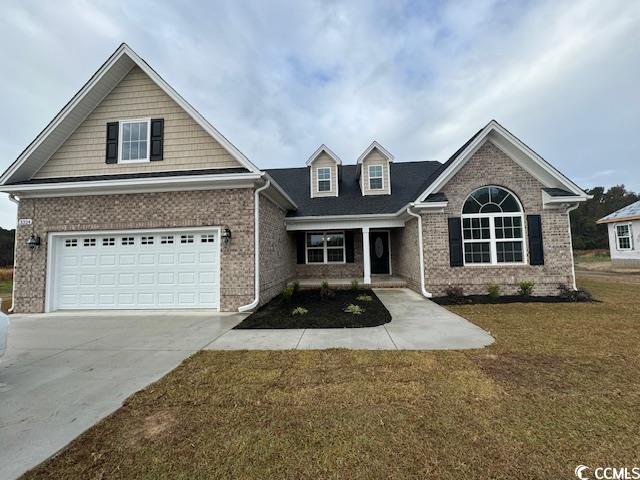 3324 Hughes Gasque Road Aynor, SC 29511 - Photo 1 of 3 View of front of house featuring a garage and a fr