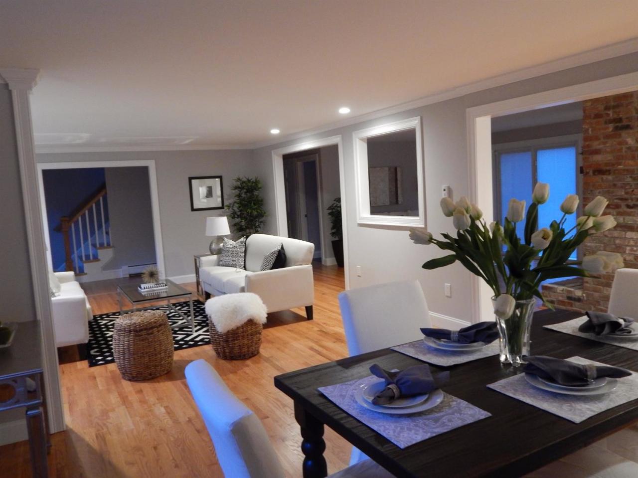 a living room with furniture potted plant and a window
