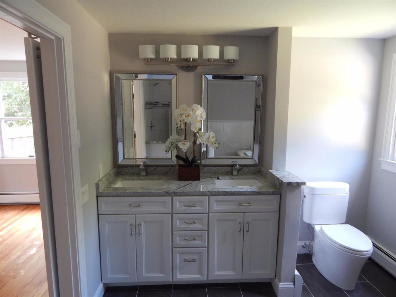 163 Fuller Road Centerville, MA 02632 - Photo 14 of 23 a bathroom with a granite countertop sink a toilet and a mirror