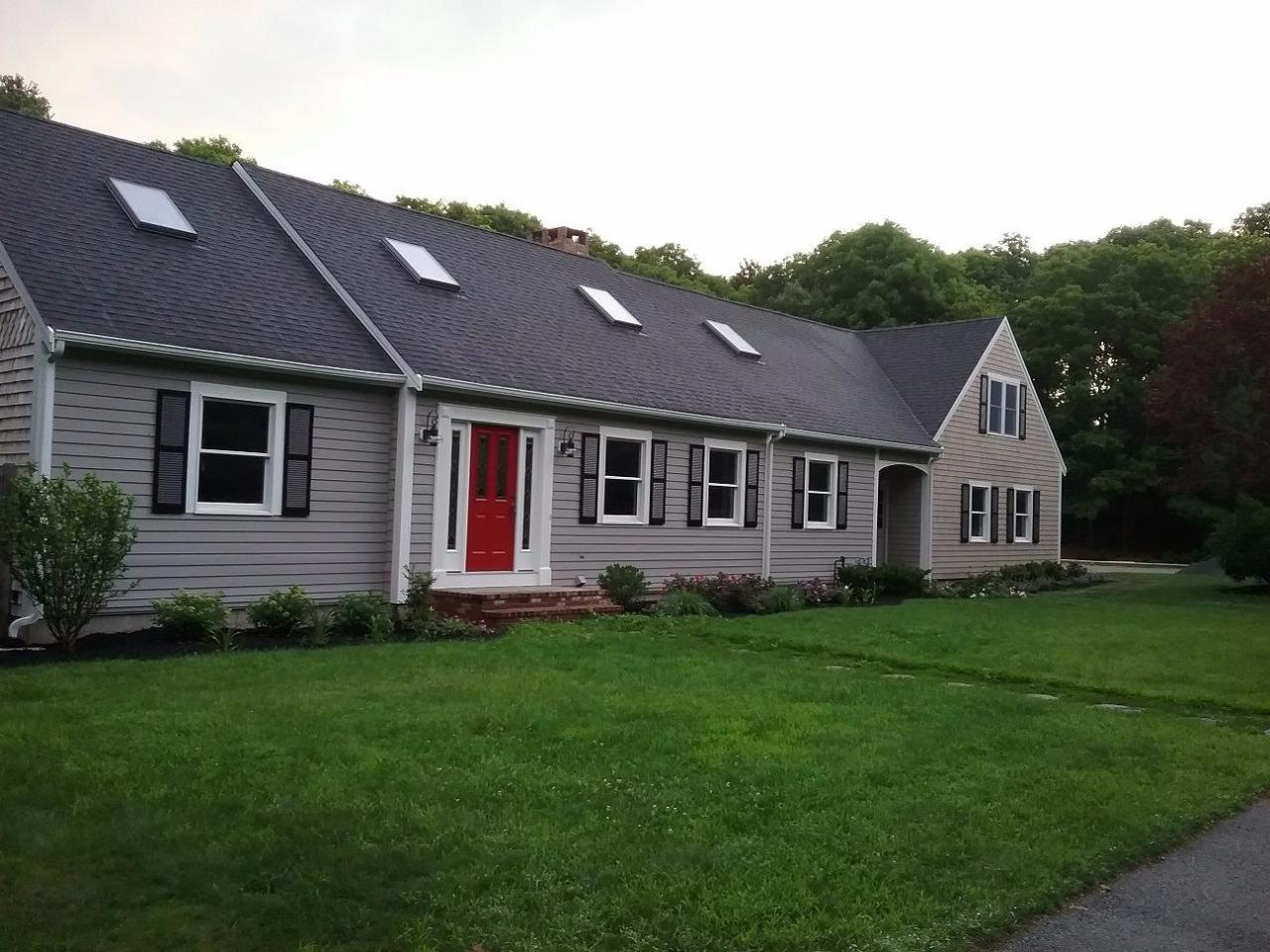 163 Fuller Road Centerville, MA 02632 - Photo 4 of 23 a front view of a house with a garden