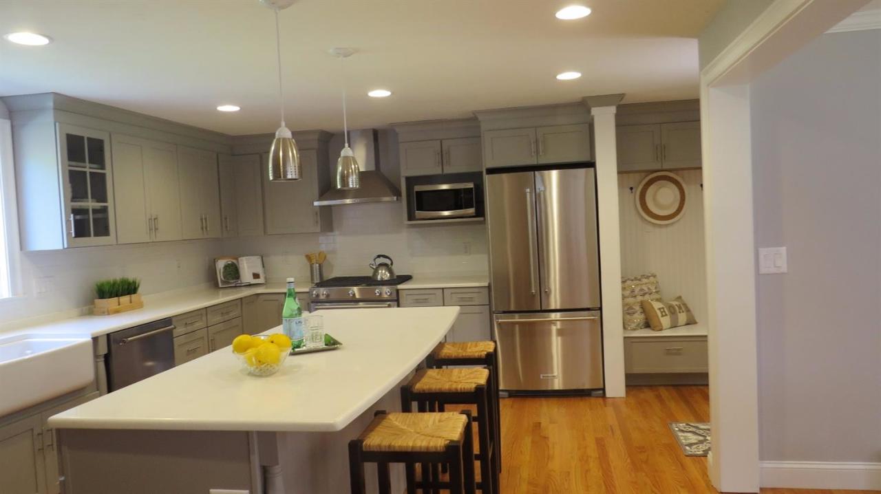 163 Fuller Road Centerville, MA 02632 - Photo 5 of 23 a kitchen with a refrigerator a sink and cabinets