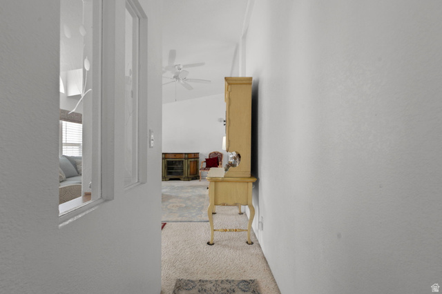 2600 North Hill Field Road, Unit 134 Layton, UT 84041 - Photo 29 of 41 Corridor with light colored carpet and a textured wall