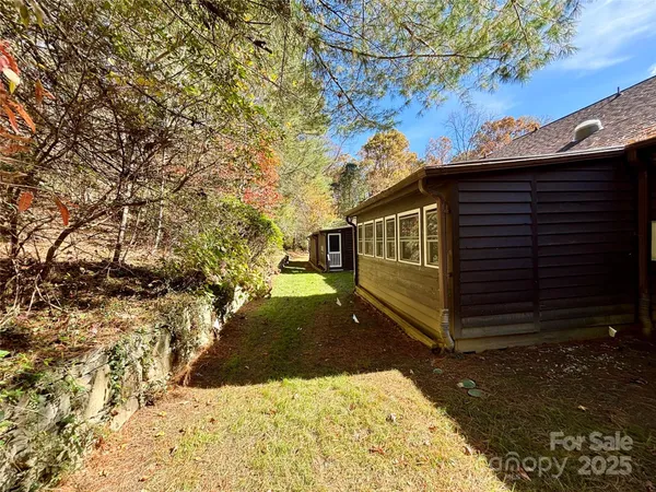 a view of a backyard of the house