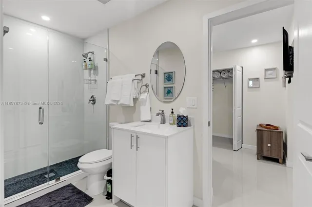 a bathroom with a sink a mirror and vanity