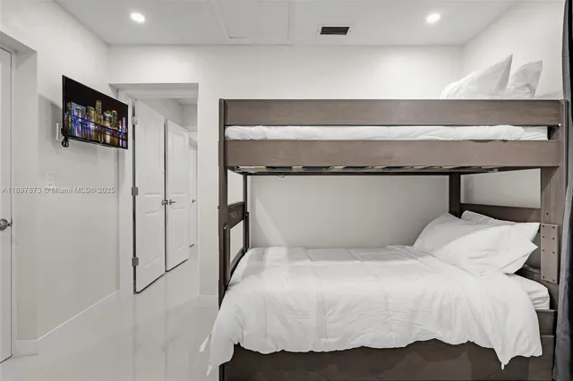 a kitchen with stainless steel appliances kitchen island a refrigerator and a stove