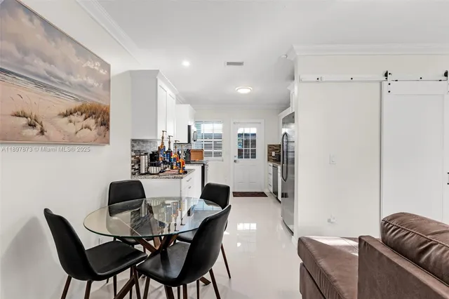 a view of a dining room with furniture
