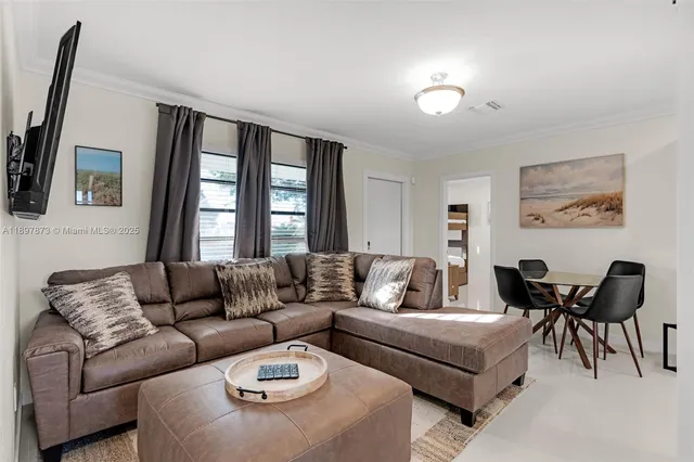 a living room with furniture and a couch