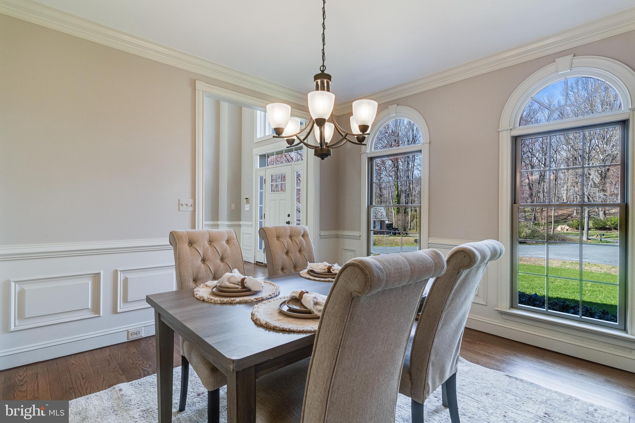 99 Hummingbird Court Dunkirk, MD 20754 - Photo 13 of 84 a dining room with furniture a chandelier and wooden floor
