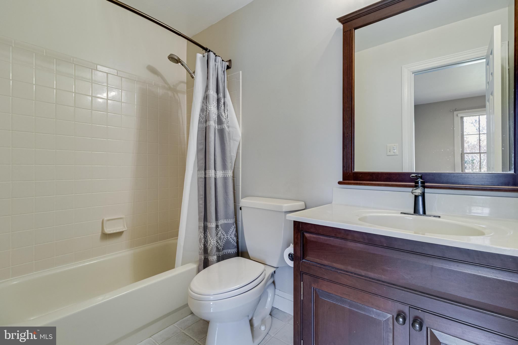 99 Hummingbird Court Dunkirk, MD 20754 - Photo 47 of 84 a bathroom with a sink a toilet and a bathtub