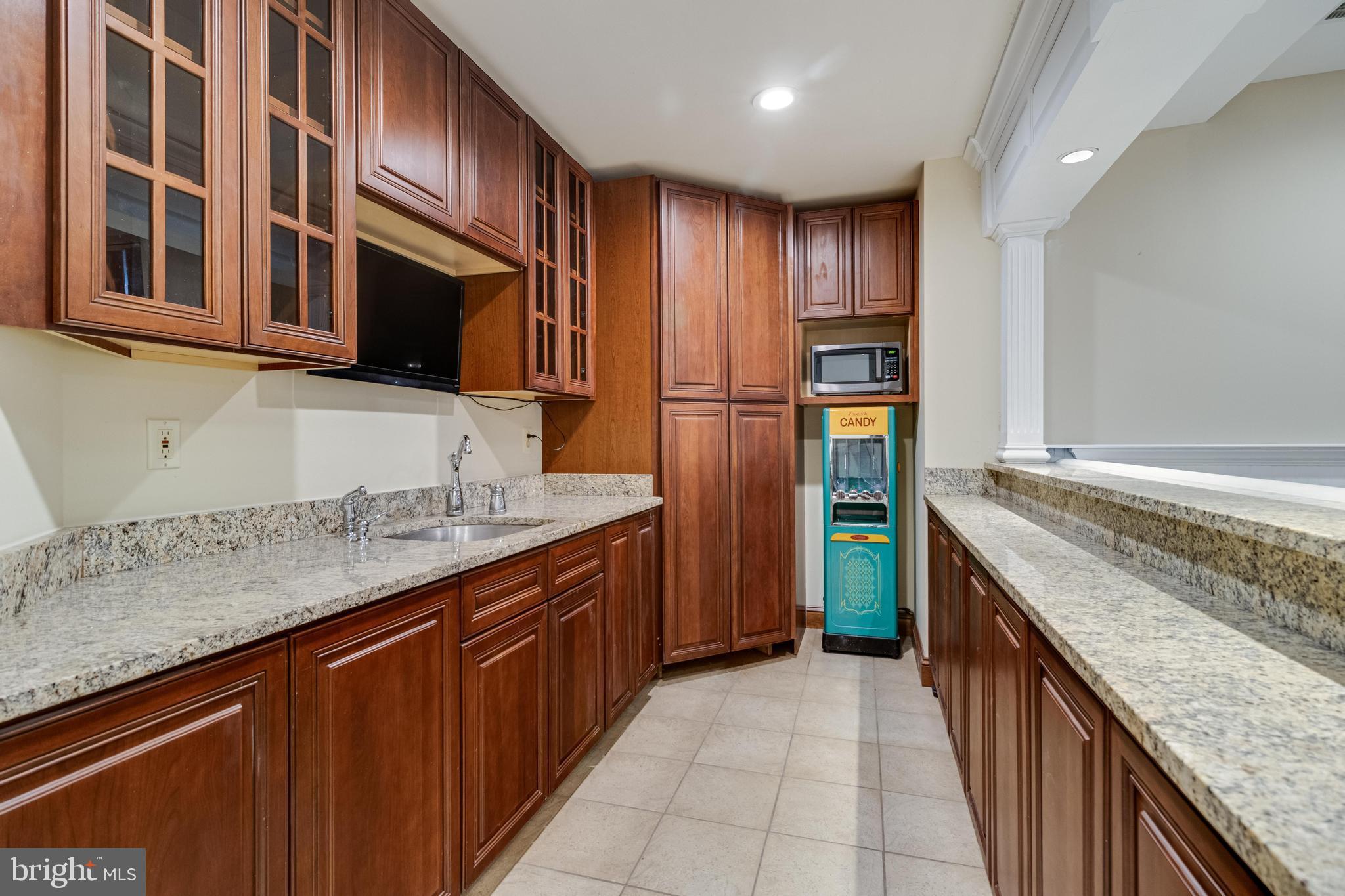 99 Hummingbird Court Dunkirk, MD 20754 - Photo 53 of 84 a kitchen with stainless steel appliances granite countertop a refrigerator and a stove