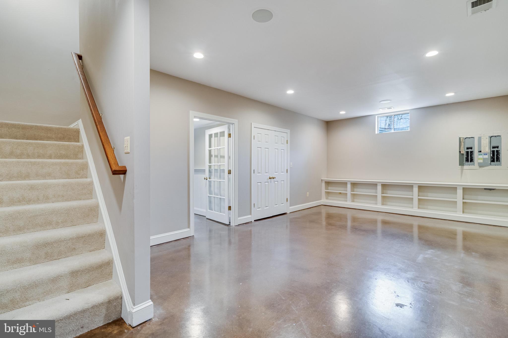 99 Hummingbird Court Dunkirk, MD 20754 - Photo 60 of 84 a view of an empty room with wooden floor and stairs