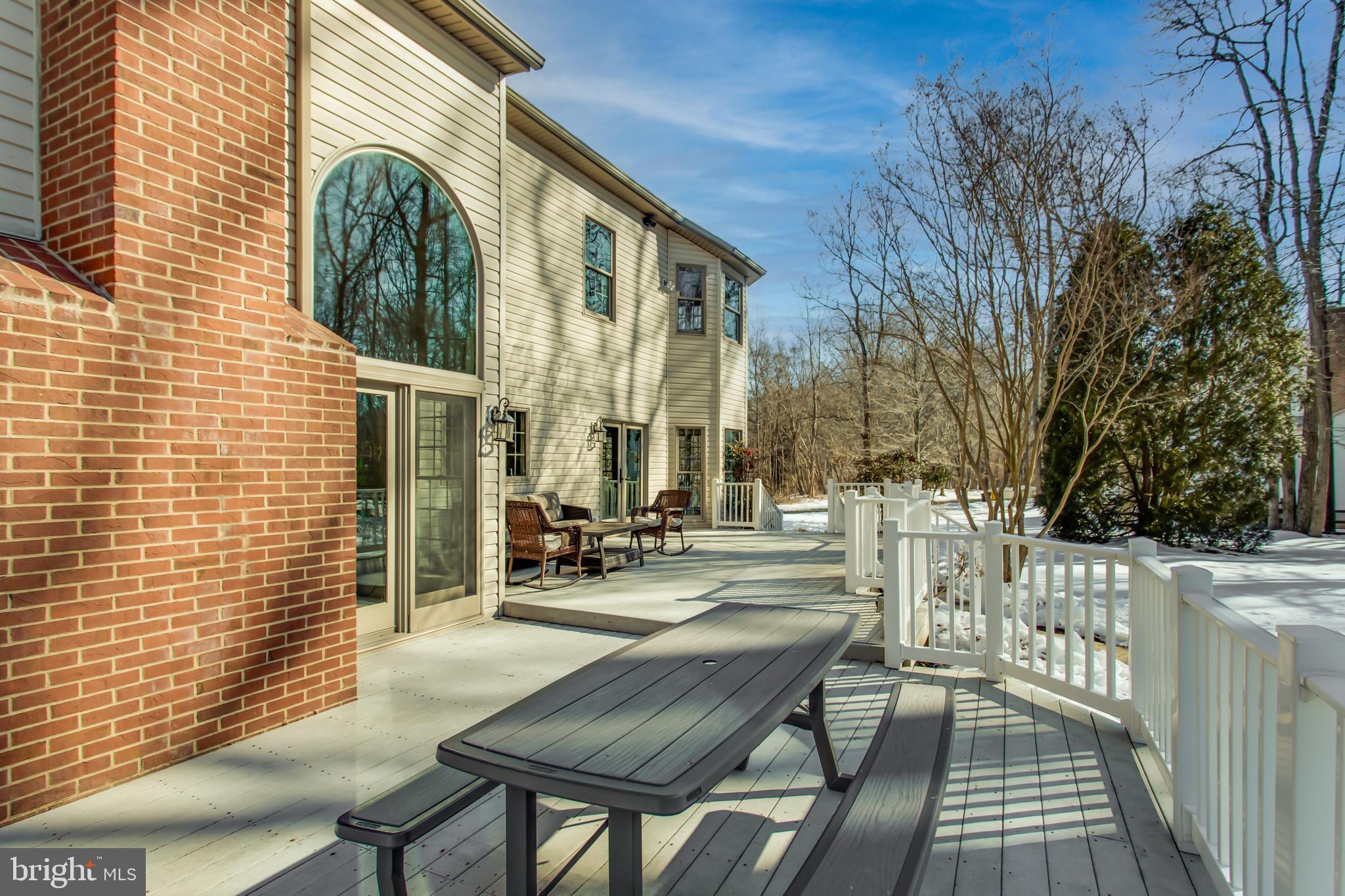 99 Hummingbird Court Dunkirk, MD 20754 - Photo 70 of 84 a view of a patio with a table and chairs