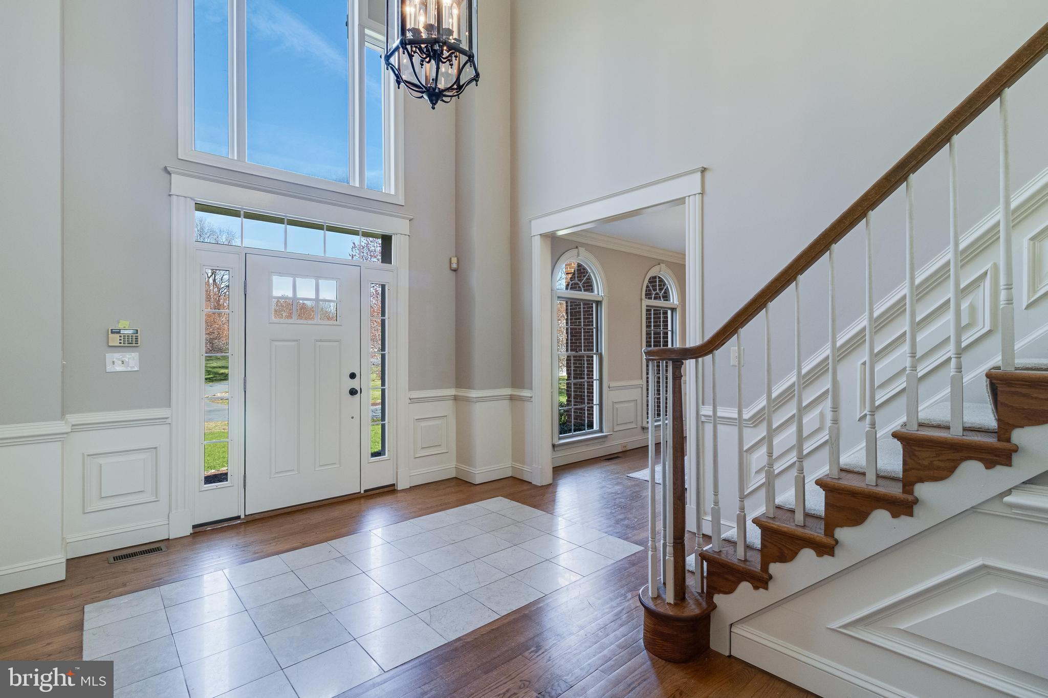 99 Hummingbird Court Dunkirk, MD 20754 - Photo 9 of 84 a view of an entryway with wooden floor and staircase