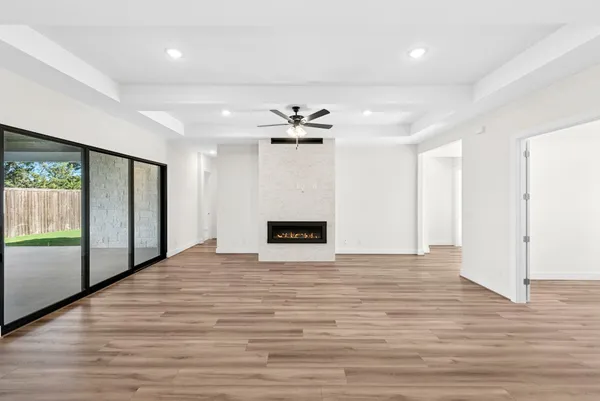 a large kitchen with kitchen island a sink stainless steel appliances and cabinets