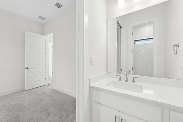 a view of an house with backyard and porch