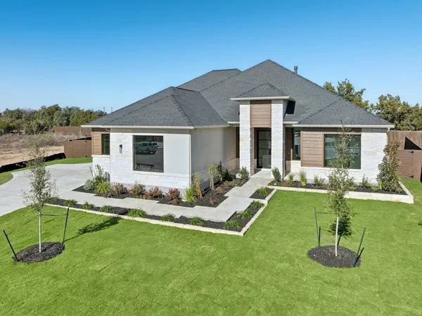 front view of a house with a yard