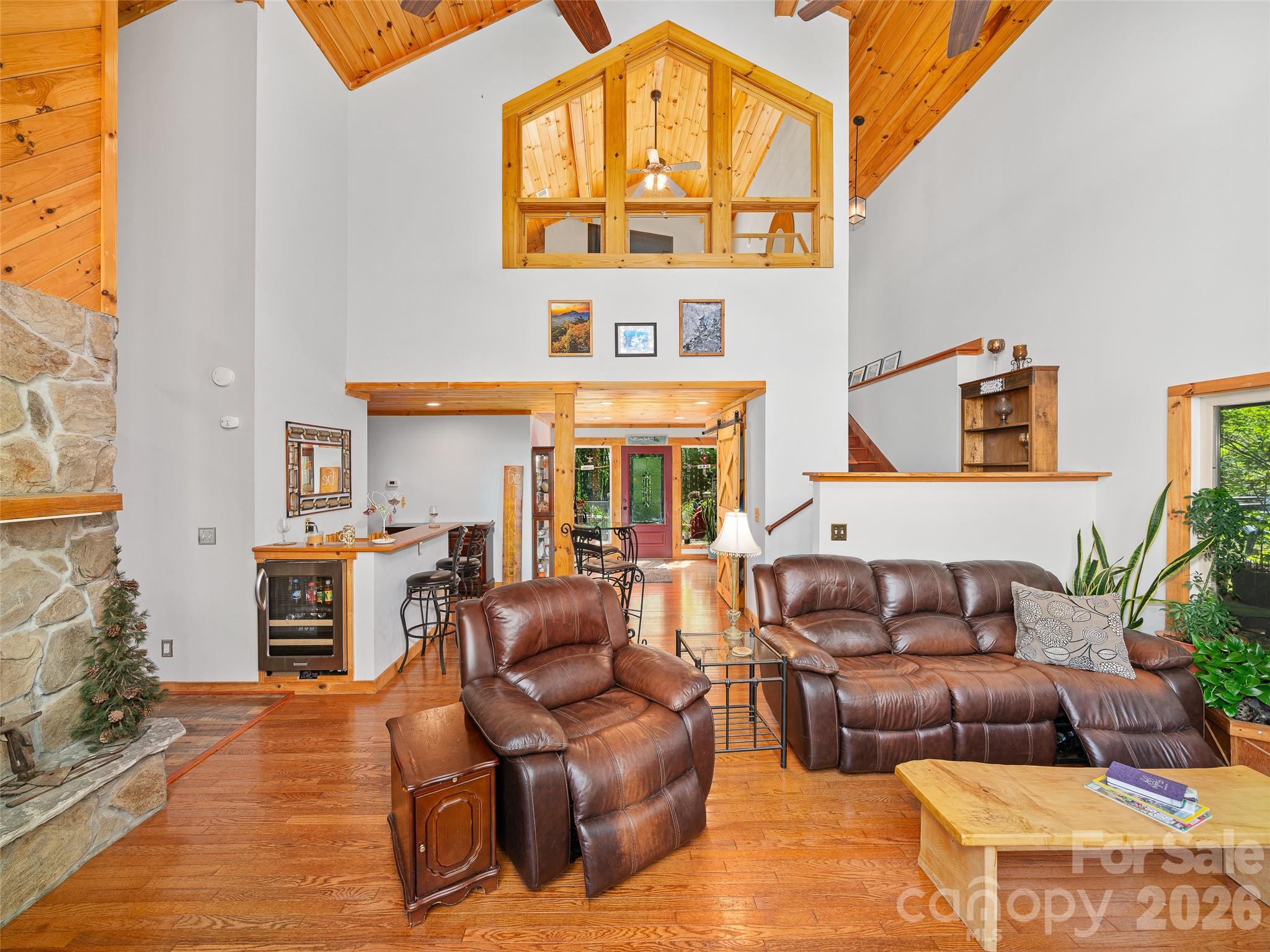 228 Continental Divide Road Spruce Pine, NC 28777 - Photo 7 of 48 a outdoor living space with furniture and a fireplace