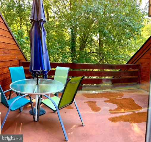 a view of a backyard with furniture and a backyard