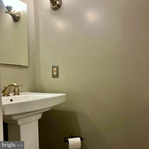 a bathroom with a sink and mirror
