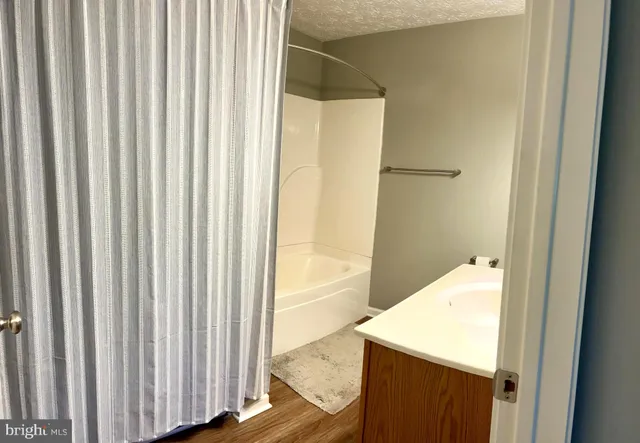 a view of a bathroom from a hallway
