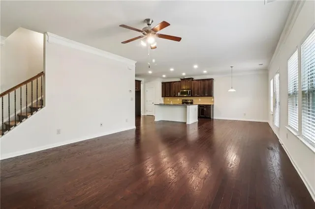 a view of a kitchen with a stove cabinets and wooden floor