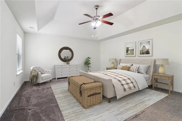 a bedroom with a large bed and a chandelier