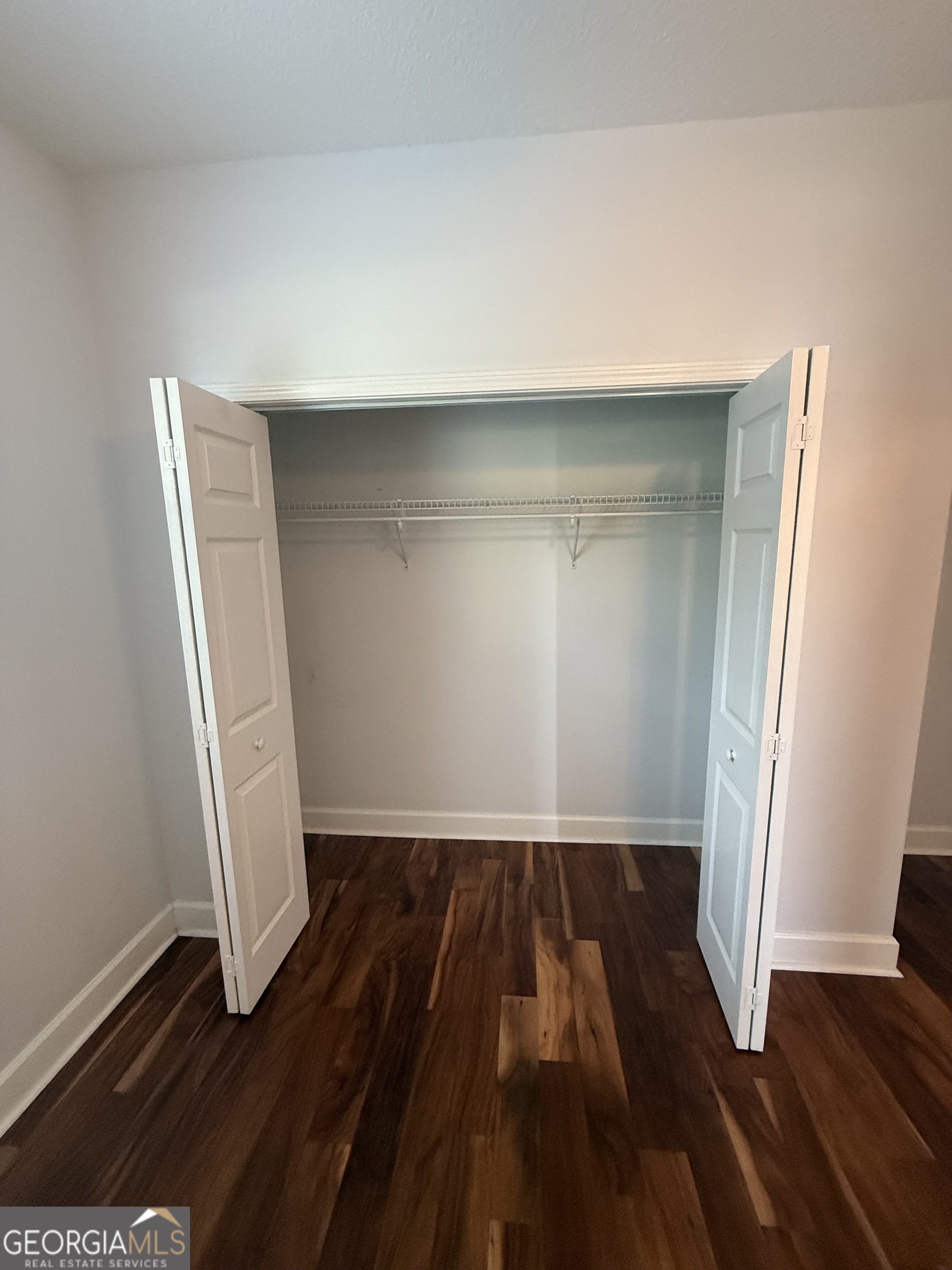 1603 Sandpiper Court St. Marys, GA 31558 - Photo 11 of 33 an empty room with wooden floor and closet