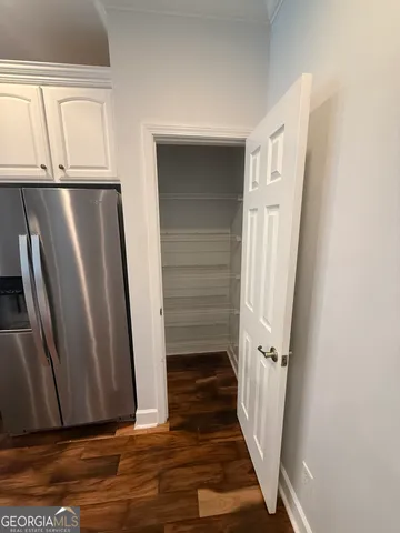 a view of entryway with wooden floor
