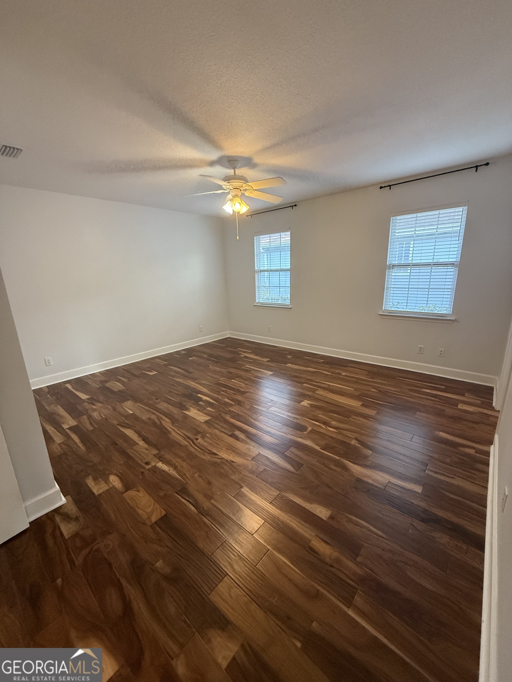 1603 Sandpiper Court St. Marys, GA 31558 - Photo 19 of 33 a view of empty room with wooden floor