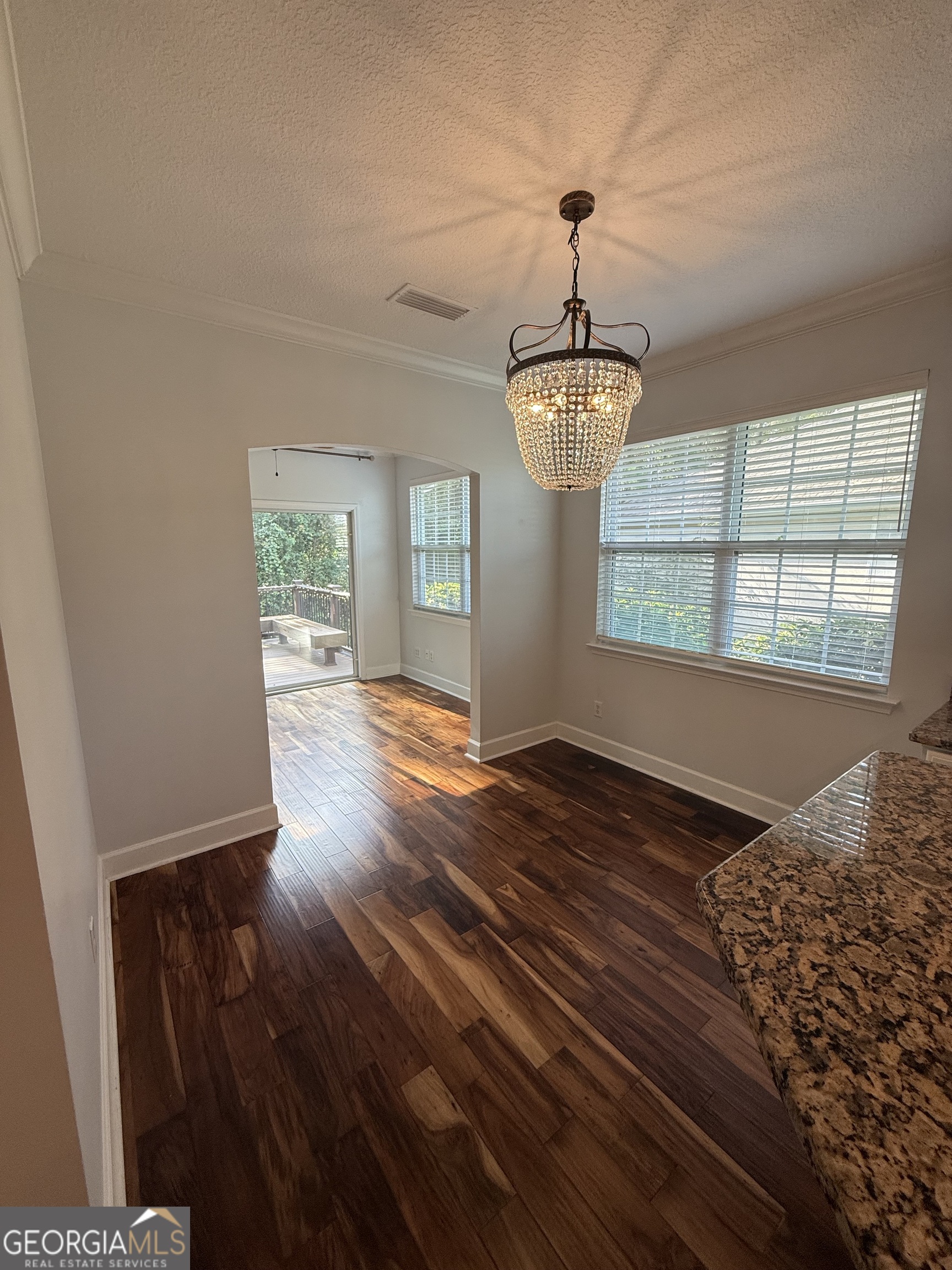 1603 Sandpiper Court St. Marys, GA 31558 - Photo 26 of 33 a view of an empty room with wooden floor and a window