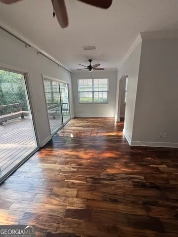 wooden floor in an empty room with a window