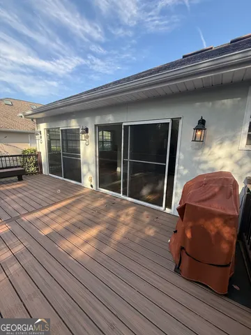a view of a two chairs in the balcony