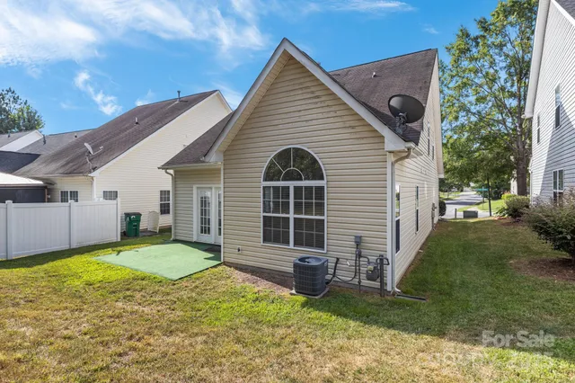 a view of a yard with large trees