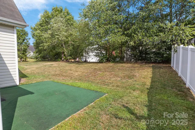 a view of a house with a yard and plants