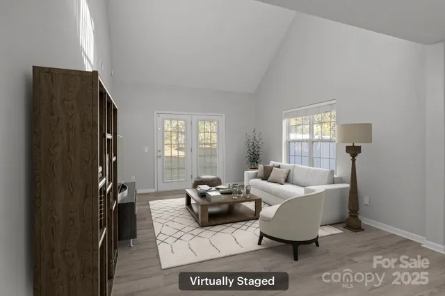 a living room with furniture window and a flat screen tv