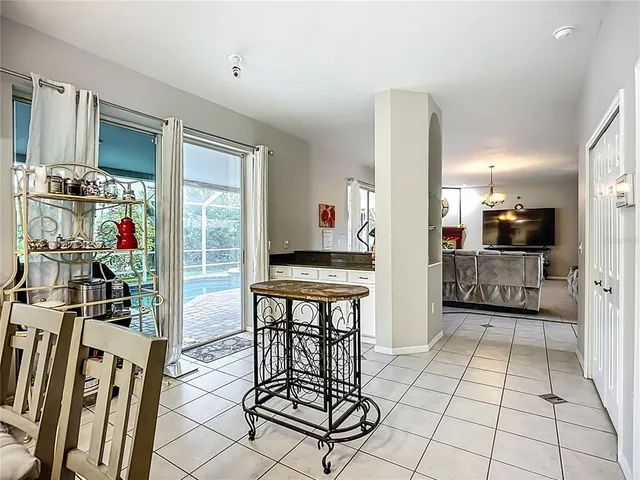 a view of a kitchen with furniture and a window