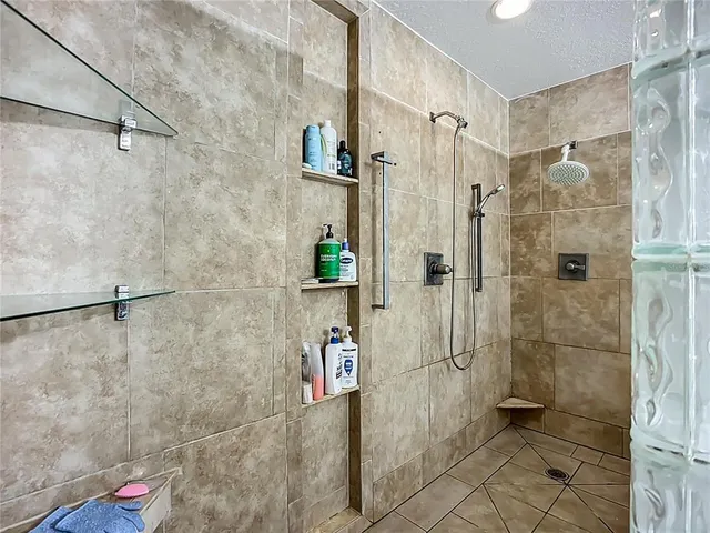 a living room with a black white checkered floor with couches and a coffee table