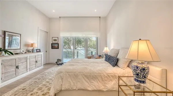 a spacious bathroom with a granite countertop sink mirror and bathtub
