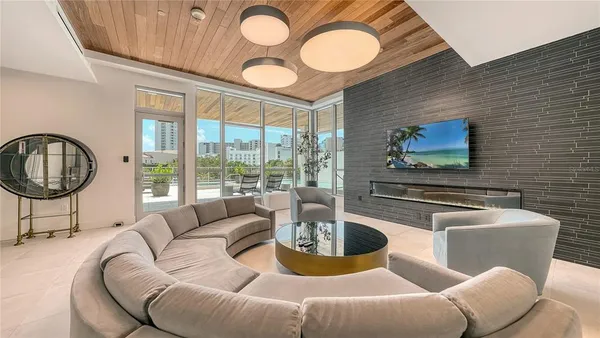 a living room with furniture and a large window