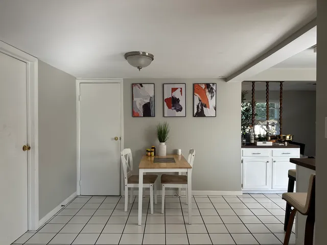 a workspace with wooden floor and furniture