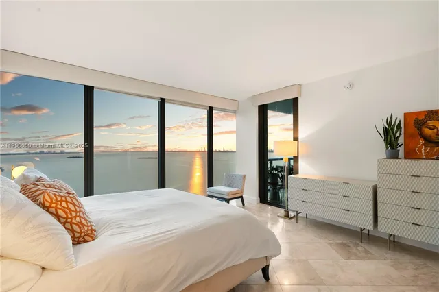 a bedroom with a bed and a chair