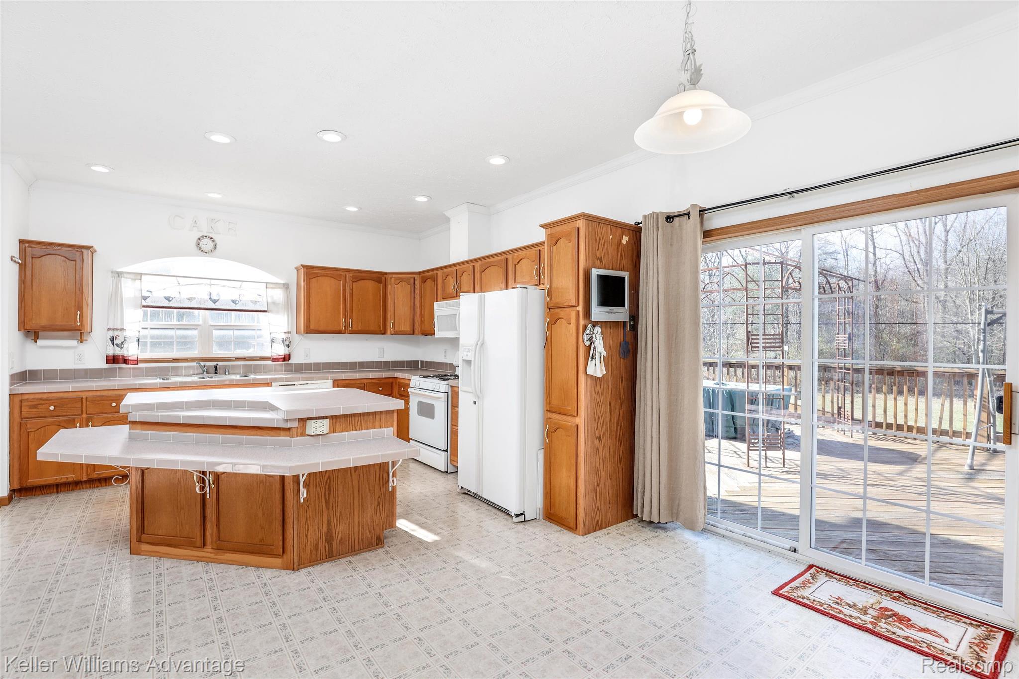 12242 Bunton Road Willis, MI 48191 - Photo 4 of 27 Kitchen also has a sliding door leading to deck